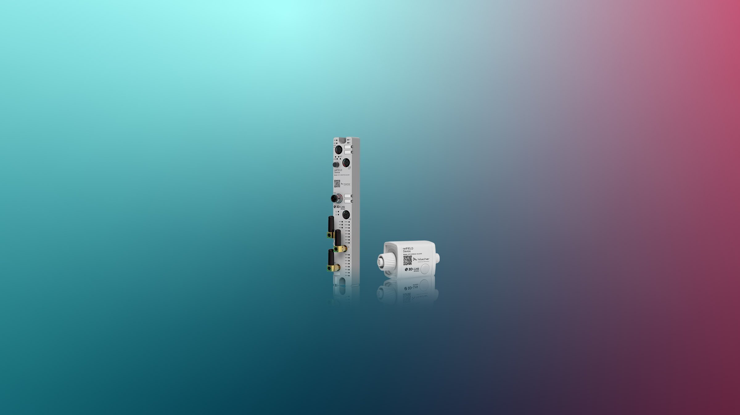 An IO-Link Wireless Master and a Bridge on a colorful background. Both devices are mainly grey and are slightly mirrored on the bottom.