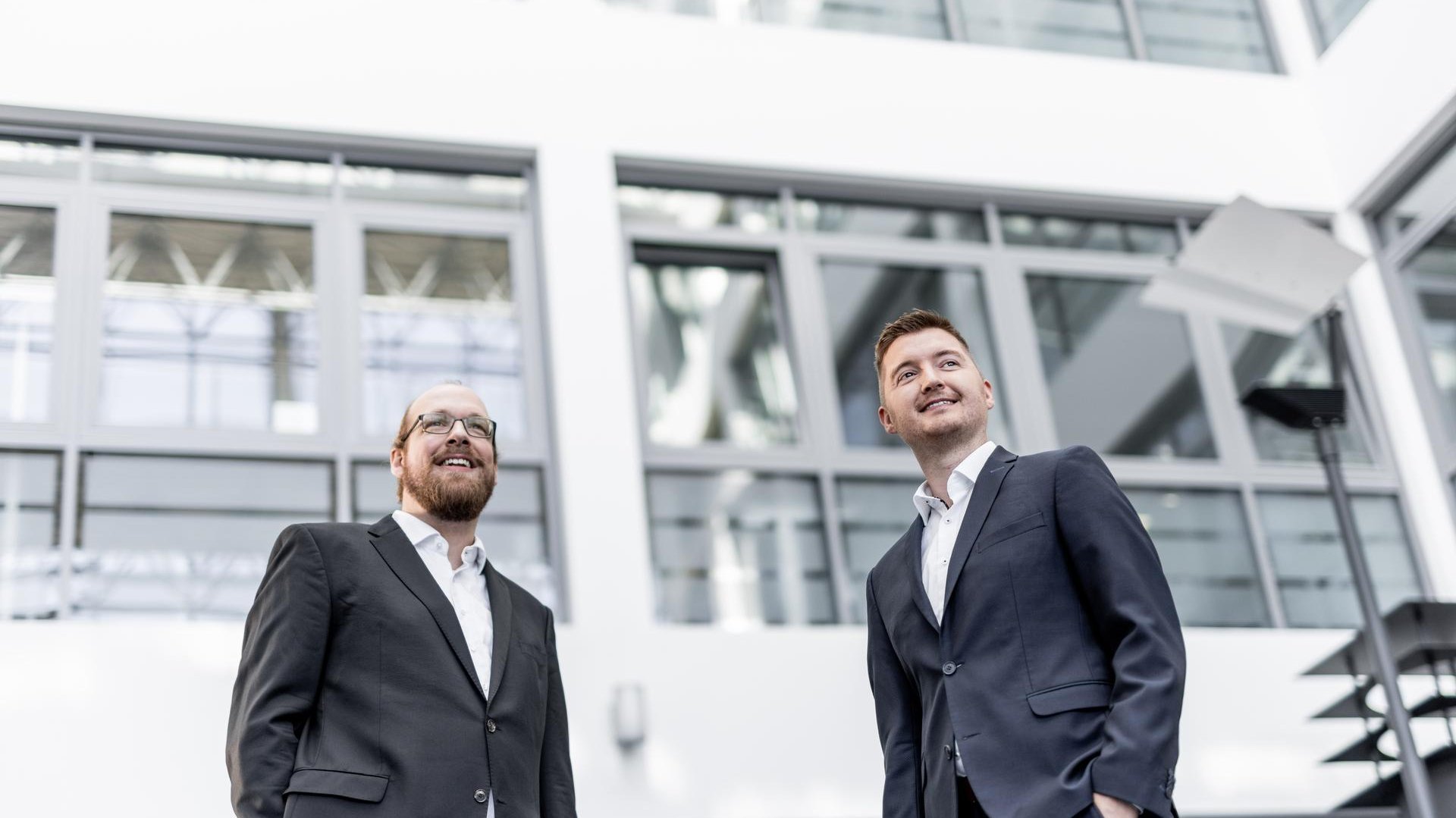 Two Hilscher employees looking at a tablet